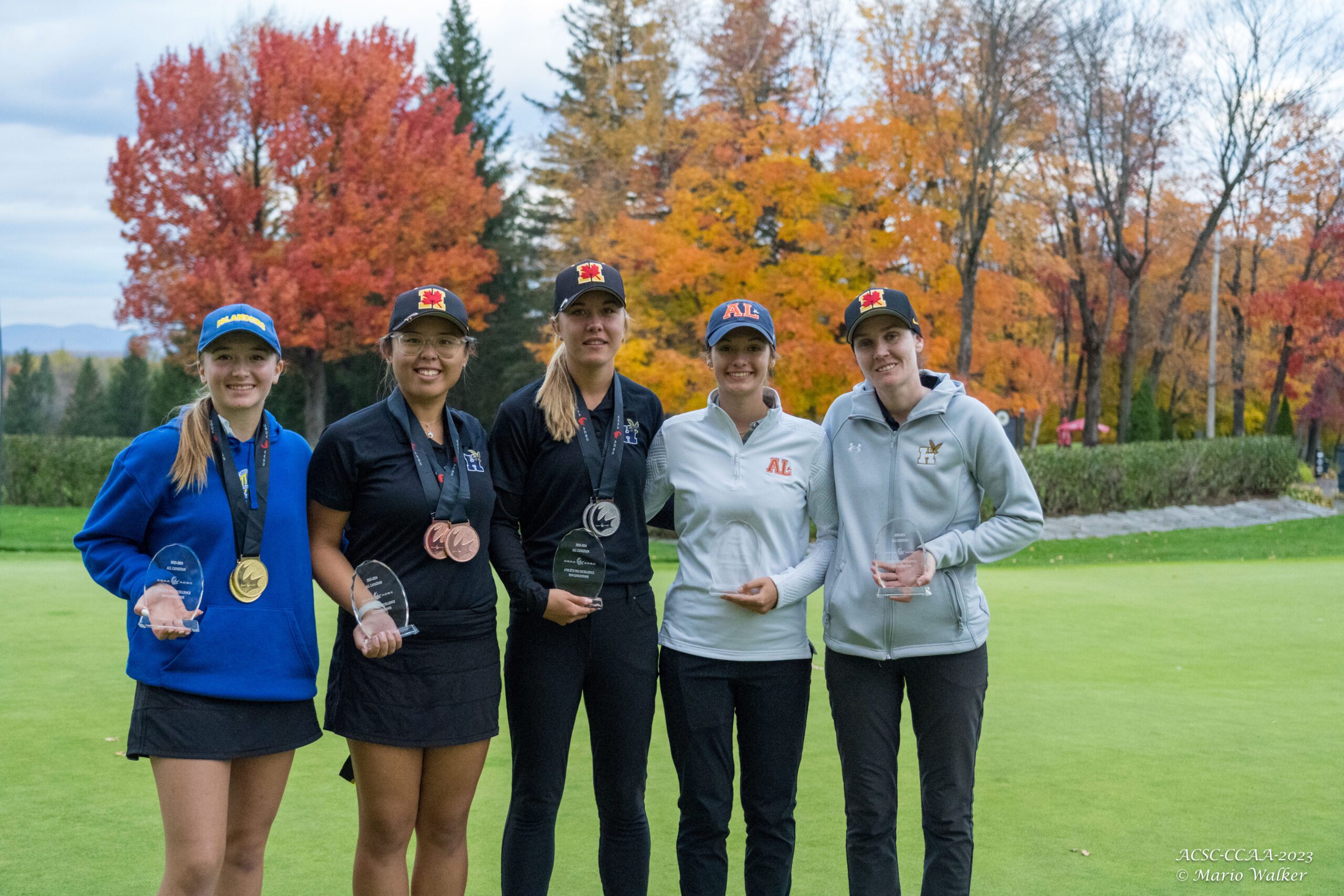 The five women's All-Canadians pose for a photo.