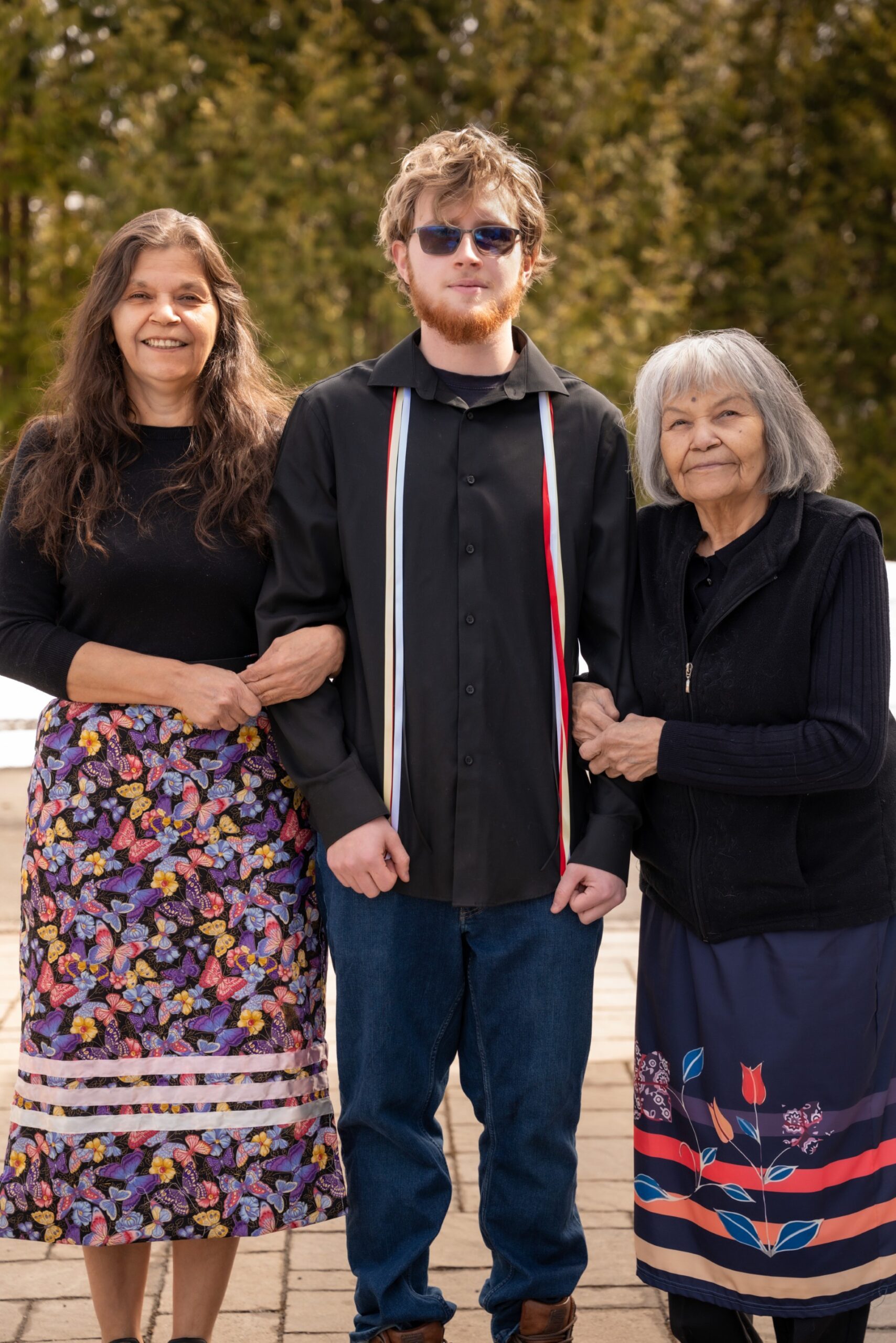 Here, Logan is pictured with his grandmother and great-grandmother